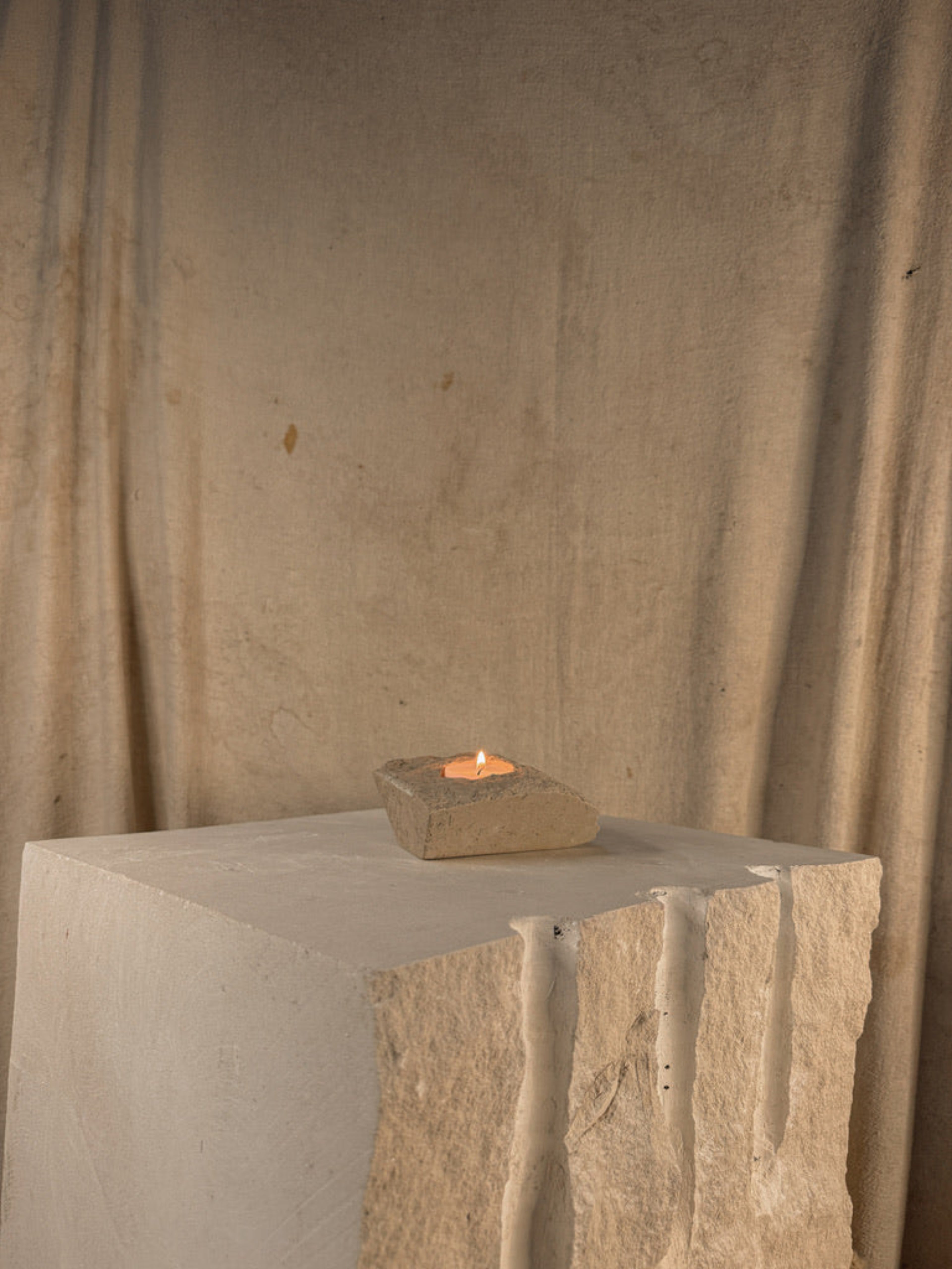 PORTLAND LIMESTONE TRITON CANDLE HOLDER