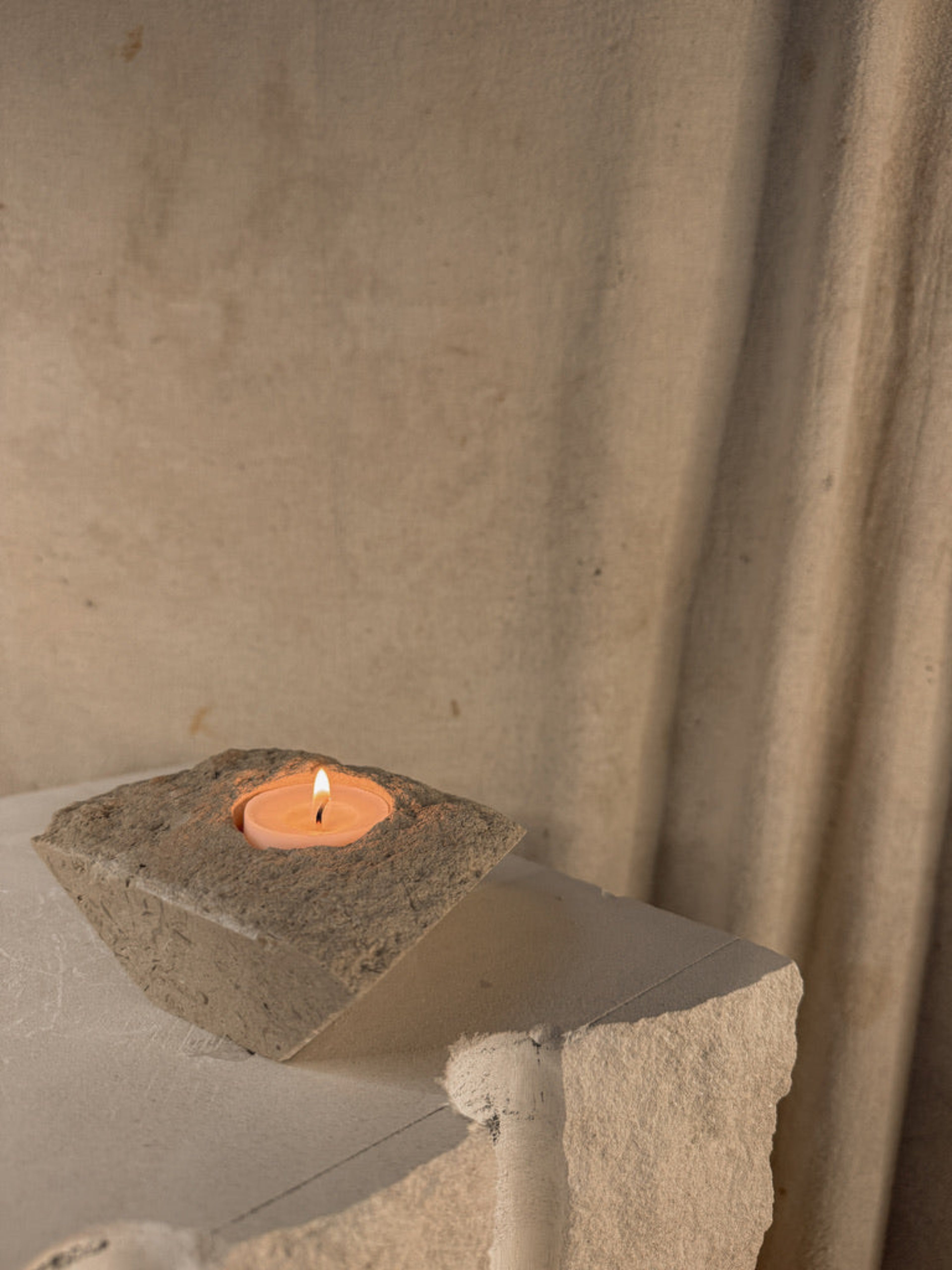 PORTLAND LIMESTONE TRITON CANDLE HOLDER